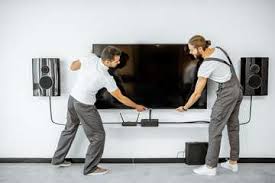 technician fixing tv